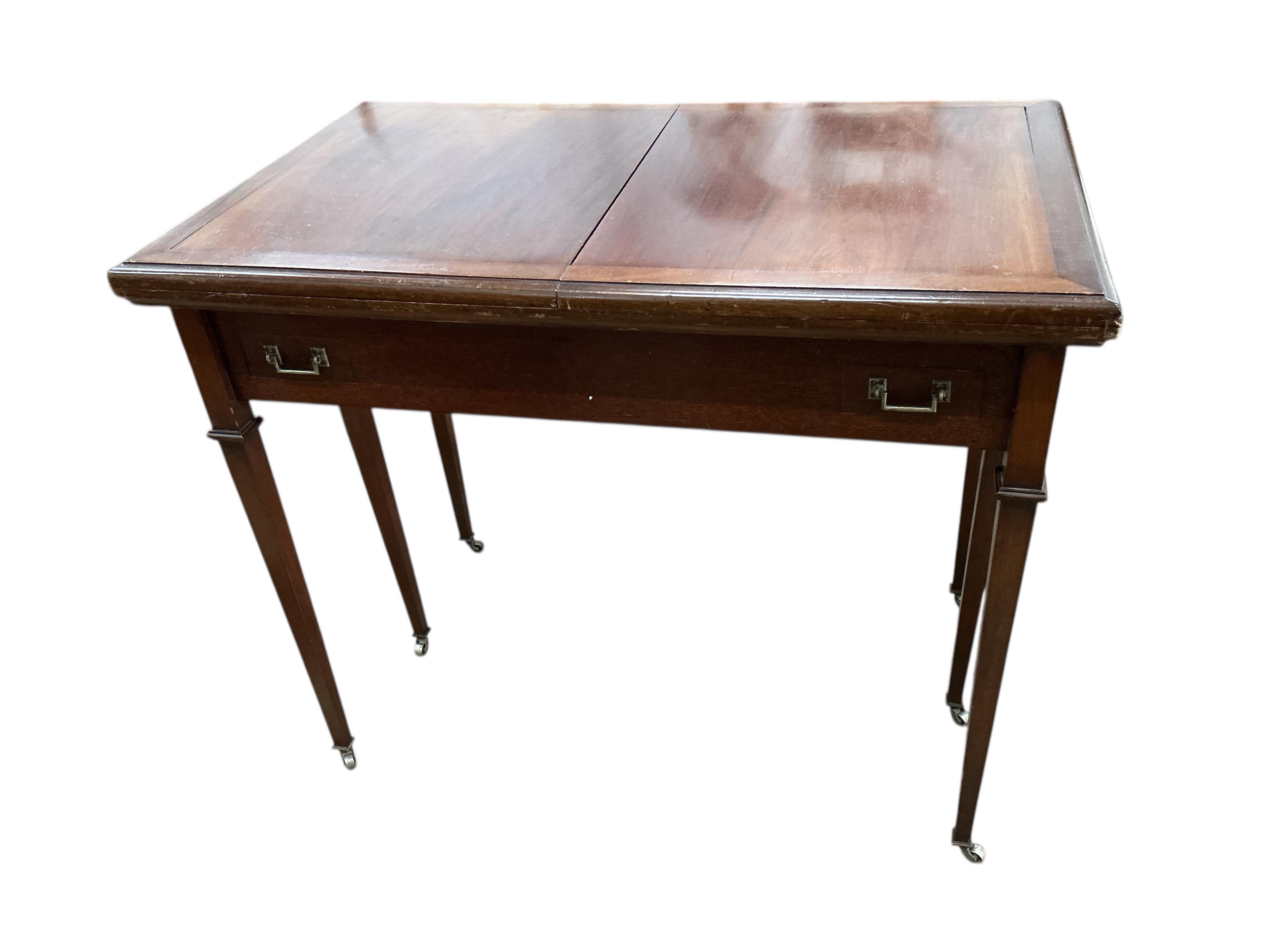 A rectangular mahogany roulette table with twin flap top, width 92cm, depth 57cm, height 77cm